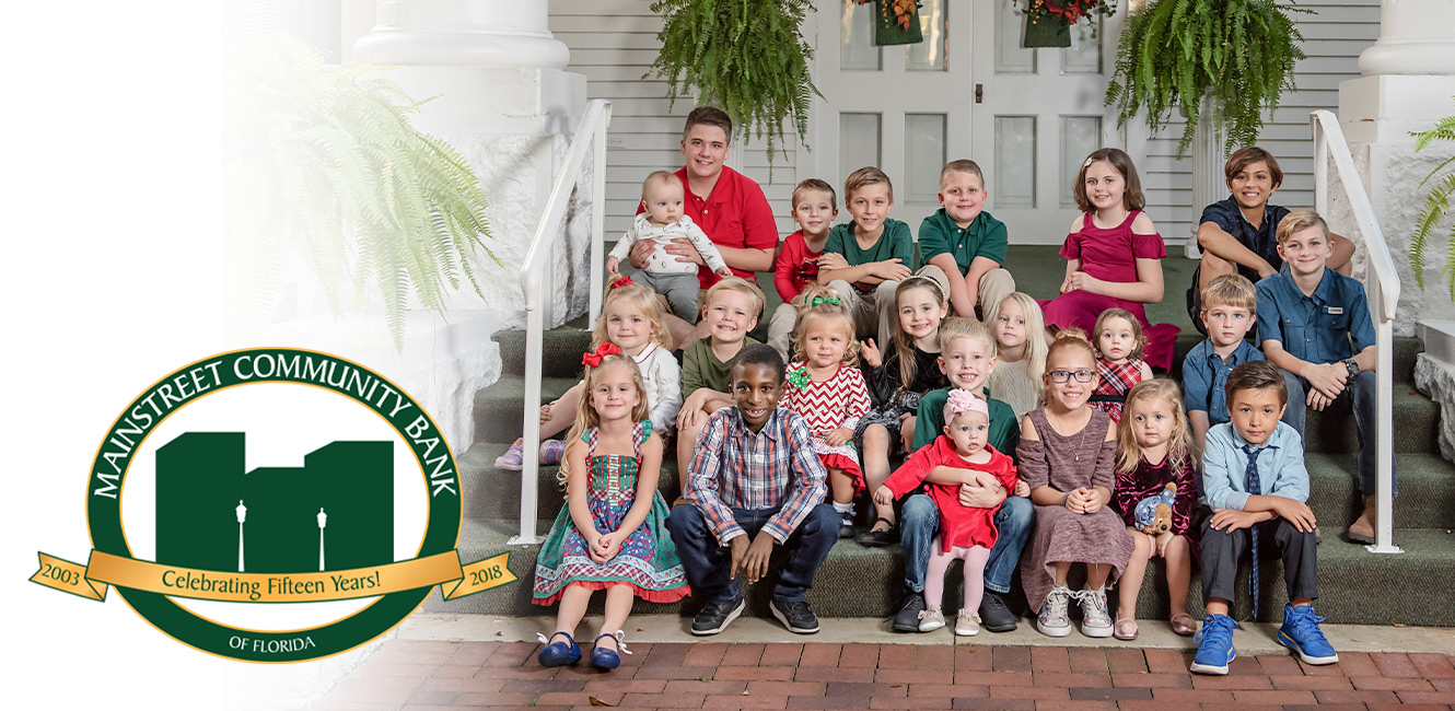 Kids in Christmas attire posing for portrait at Stetson University