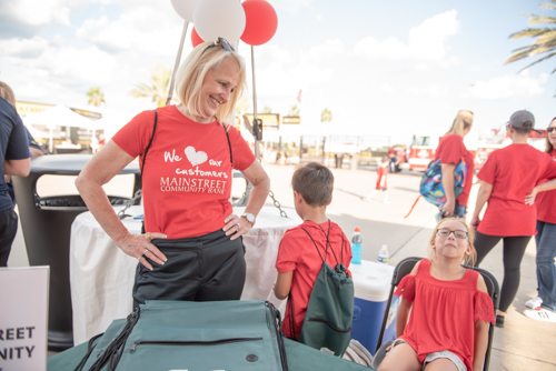 Team Mainstreet handing out bags before the Heart Walk at Daytona International Speedway