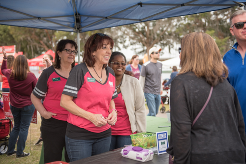 Team Mainstreet greeting event goers at Pig on the Pond