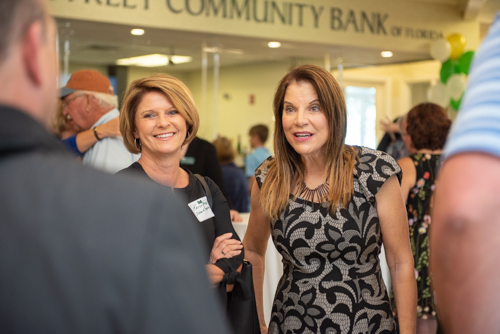 Guests chatting with members of Team Mainstreet during Clermont's 2nd Anniversary Celebration