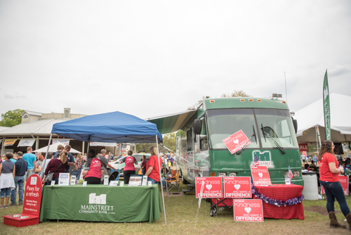 Mainstreet Community Bank RV and tent set up at Pig on the Pond