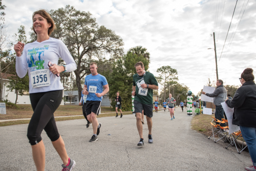 A member of Team Mainstreet running in the MeStrong 5k race in DeLand