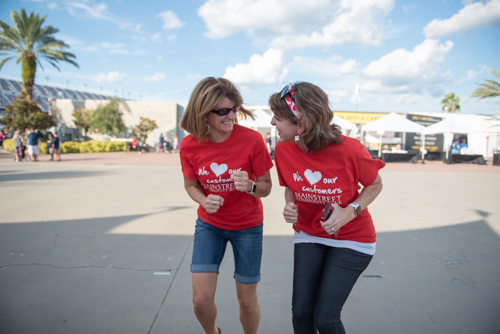 Team Mainstreet running in place and laughing before the Heart Walk at Daytona International Speedway