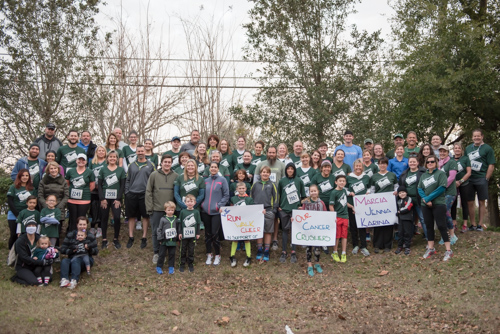 Members of Team Mainstreet posing for a group portrait before the MeStrong 5k