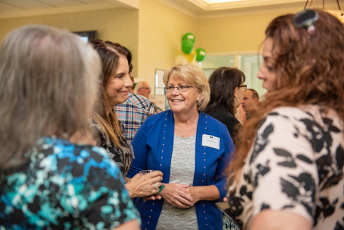 Guests chatting with members of Team Mainstreet during Clermont's 2nd Anniversary Celebration