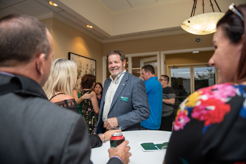 Guests chatting with members of Team Mainstreet during Clermont's 2nd Anniversary Celebration