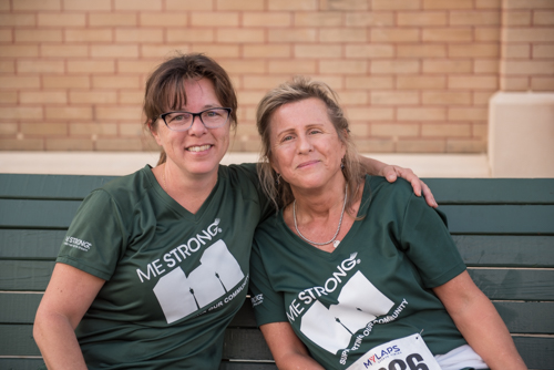 Two women representing Team Mainstreet smiling for a photo after running in the MeStrong 5k race in DeLand