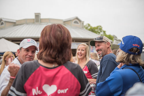 Team Mainstreet laugh with each other during Pig on the Pond event