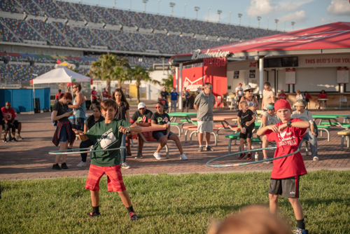 Younger members of Team Mainstreet hula hooping before the Heart Walk at Daytona International Speedway