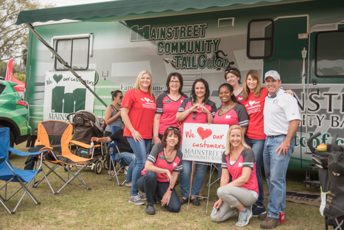 Group photo for Team Mainstreet at Pig on the Pond