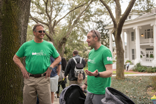 Members of Team Mainstreet chatting before the Mardi Gras on Mainstreet Parade in DeLand