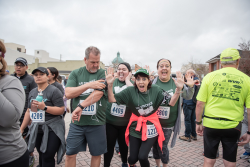 Mainstreet team members joke around before MeStrong race in DeLand