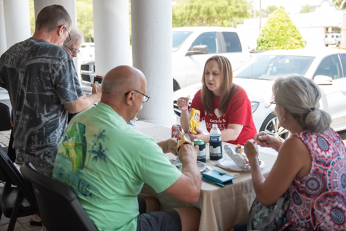 Customers eat and chat during customer appreciation at Holly Hill Mainstreet Community Bank branch