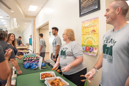 Mainstreet Community Bank employees chat with teachers at DeLand High School while they serve lunch