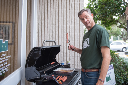 Orange City Team Member grills hot dogs for Customer Appreciation Day