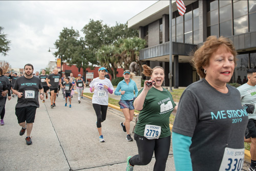 Member of team Mainstreet running during MeStrong race in DeLand