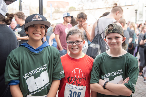 Three boys after MeStrong race near finish line