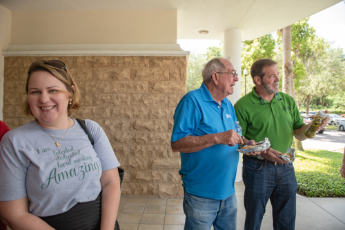 Customers and Mainstreet Employees chat during Customer Appreciation Day in downtown DeLand