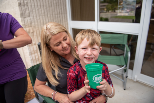 A child smiles during Orange City's Customer Appreciation Day