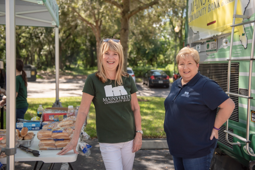 Women pose for a picture at Fall Customer Appreciation Day in DeLand