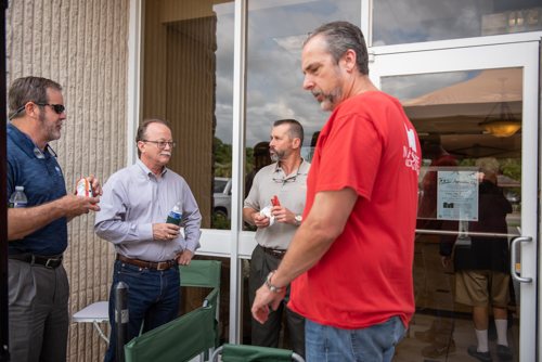 Team members chat during Mainstreet Community Bank's Customer Appreciation Day in Orange City