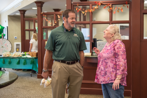 Bank president and team member chat during Customer Appreciation Day at North Spring Garden Branch