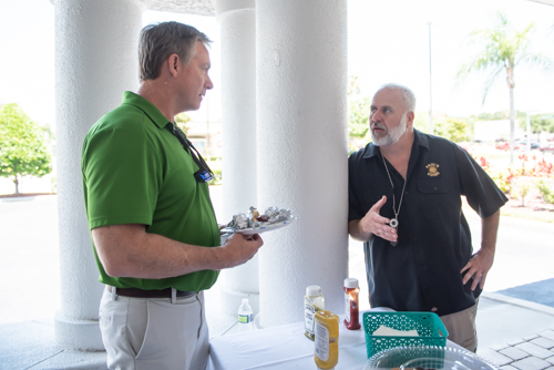 Two customers chat at Holly Hill branch customer appreciation