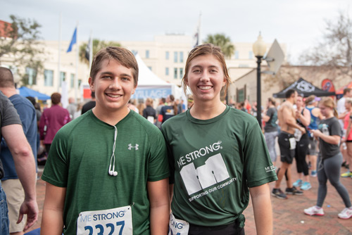 Two young runners on Team Mainstreet after MeStrong race