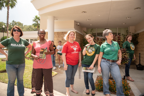 Members of Team Mainstreet watch parade in downtown DeLand