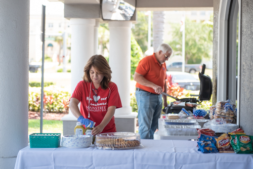 Two Mainstreet employees prepare for their Customer Appreciation Day in East Volusia