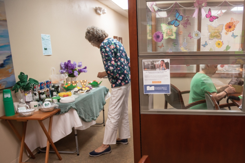 A customer gets a snack from the food table at Mainstreet Community Bank in John Knox Village