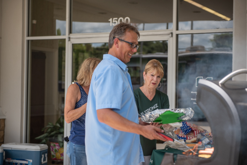 Team Mainstreet grills hamburgers at Customer Appreciation Day in DeLand