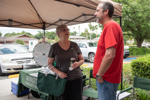 Orange City Branch Manager chats with customer at Customer Appreciation Day